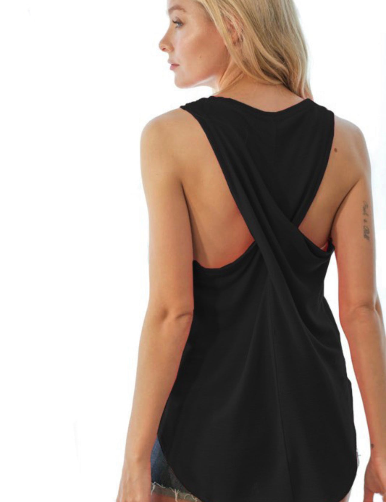 “Sleeveless top with back cross details”